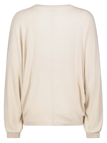 Sweter w kolorze beżowym
