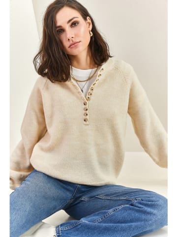 Sweter w kolorze beżowym