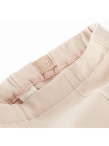 Legginsy w kolorze beżowym