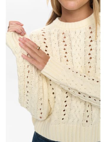 Sweter w kolorze beżowym