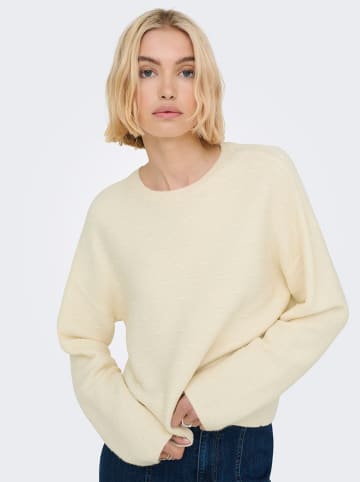 Sweter w kolorze beżowym