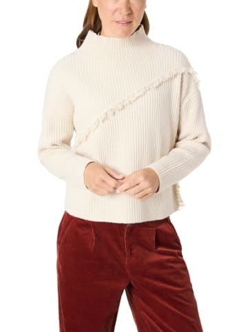 Sweter w kolorze beżowym