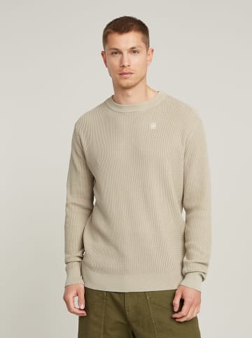 Sweter w kolorze beżowym