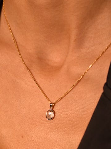 L instant d Or Gold-Anhänger mit Edelstein