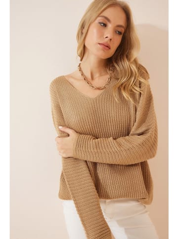 Sweter w kolorze beżowym