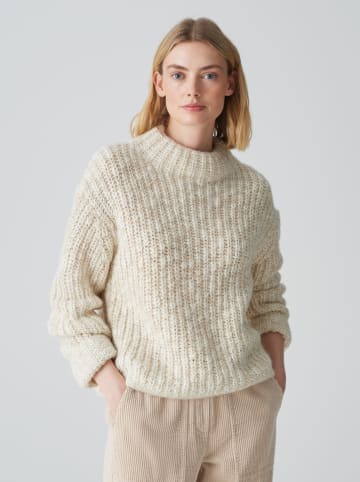 Sweter w kolorze beżowym
