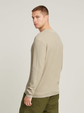Sweter w kolorze beżowym