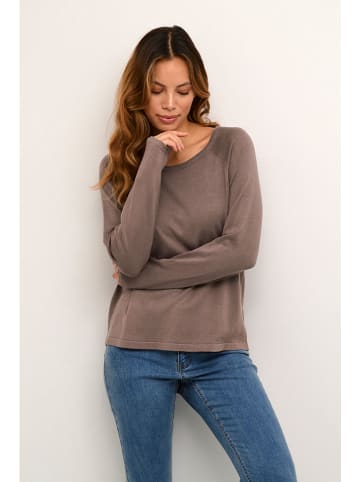 Sweter w kolorze beżowym