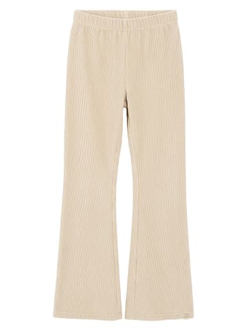 Legginsy w kolorze beżowym