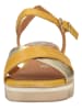 Marco Tozzi Skórzane sandały w kolorze żółtym na koturnie