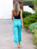 Isla Bonita by SIGRIS Spodnie w kolorze turkusowym ze wzorem