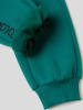Benetton Spodnie dresowe w kolorze zielonym