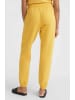 O´NEILL Spodnie dresowe "Future Surf Society" w kolorze żółtym