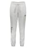 New Balance Spodnie dresowe w kolorze jasnoszarym