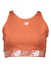 New Balance Biustonosz sportowy "Relentless" w kolorze pomarańczowym