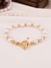 L'Atelier de Gaia Vergulde armband met parels