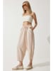 Happiness Istanbul Spodnie w kolorze beżowym