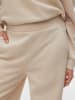 Vero Moda Spodnie dresowe w kolorze kremowym