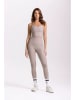 Onamaste Legginsy sportowe "Lotus" w kolorze szarobrązowym