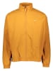 Nike Sportswear Kurtka sportowa "Solo Swoosh Woven" w kolorze pomarańczowym