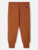 Reima Spodnie dresowe "Misam" w kolorze pomarańczowym