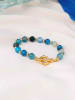 Pierres de Jade Vergold. Armband mit Schmuckelementen