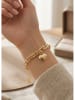 atelier MIU Vergold. Armkette mit Schmuckelement