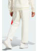 adidas Spodnie dresowe "Future Icons Badge of Sport" w kolorze kremowym
